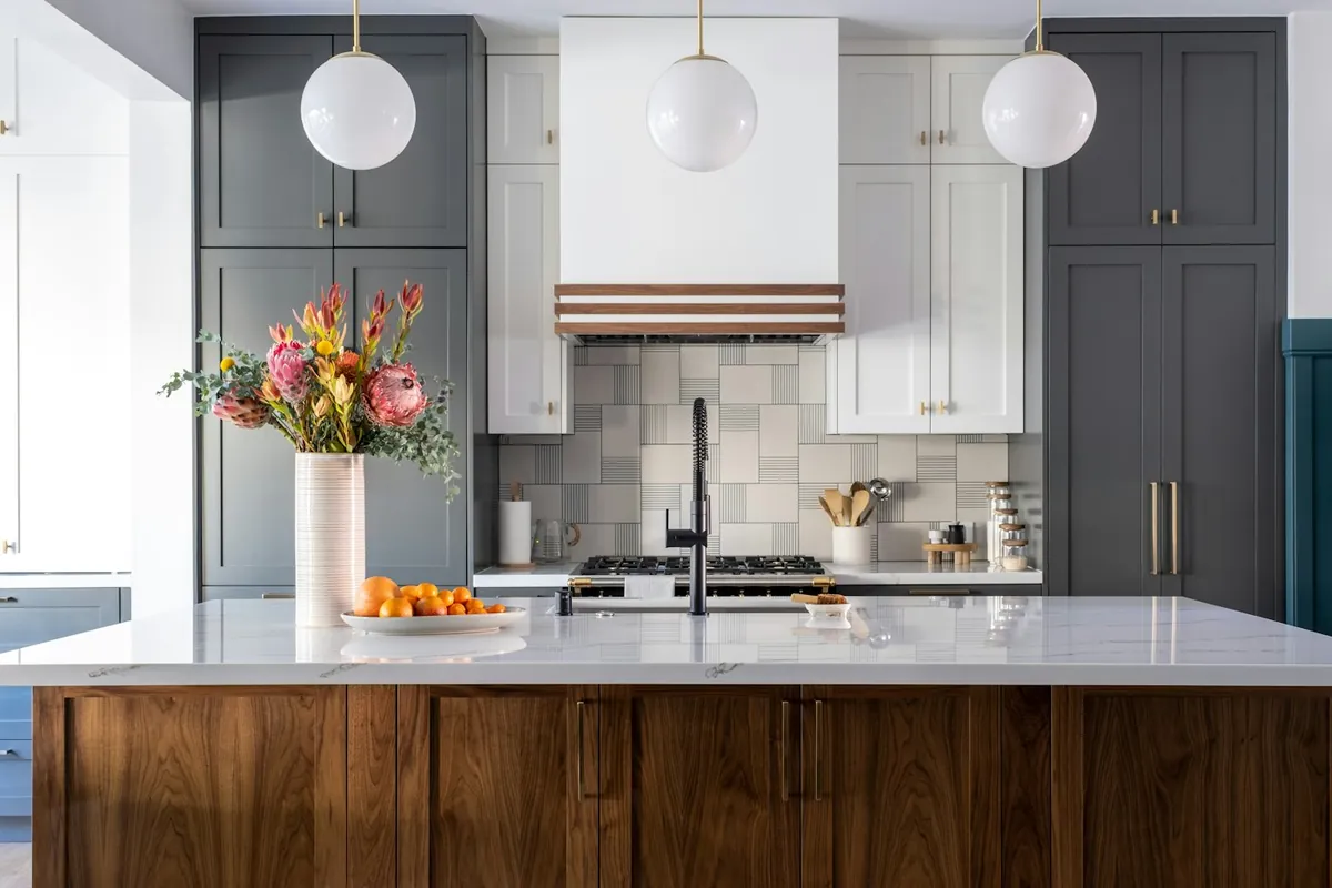 Custom kitchen cabinets with a walnut island in a Lancaster CA home